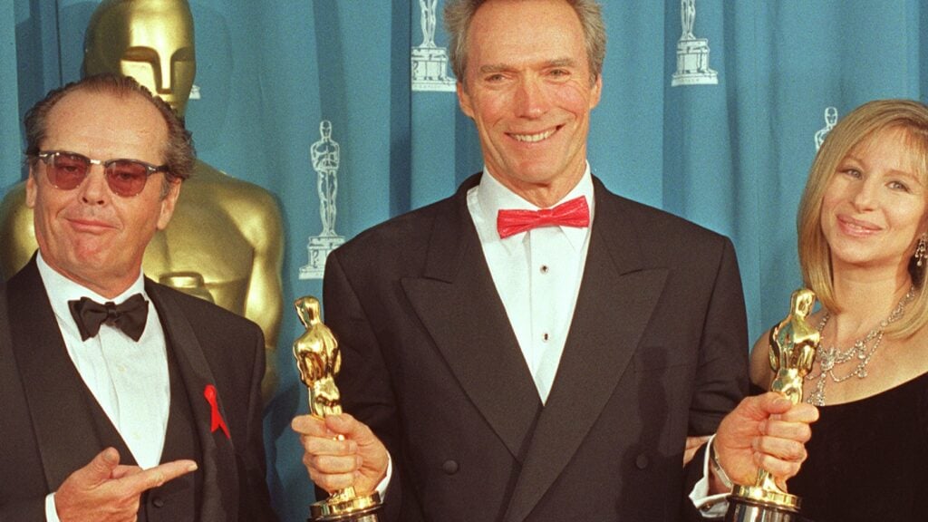 Clint Eastwood holds up his two Oscars at the 65th Annual Academy Awards 29 March 1993 that he won for Best Director and Best Picture for